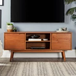 58 in. Caramel Solid Wood TV Stand Fits TVs up to 65 in. with Cutout Cabinet Handles by Welwick Designs