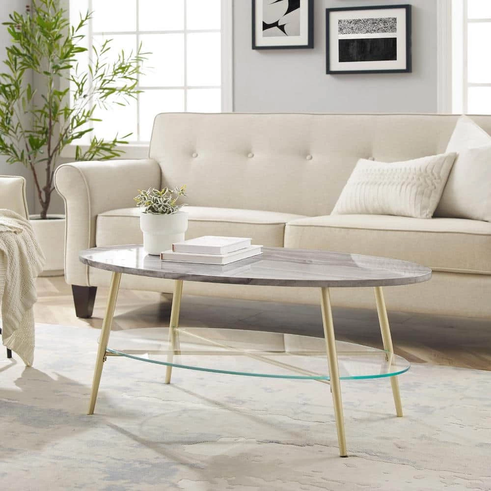 42 in. Grey Faux Marble Wood and Gold Metal Glam Oval Coffee Table with Lower Glass Shelf by Welwick Designs 2 42 in. Grey Faux Marble Wood and Gold Metal Glam Oval Coffee Table with Lower Glass Shelf by Welwick Designs - Image 2